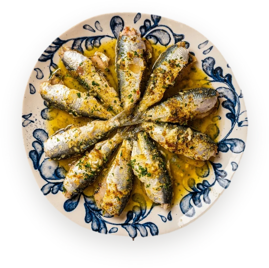 Sardines à l’algérienne dressées en rosace sur une assiette de faïence